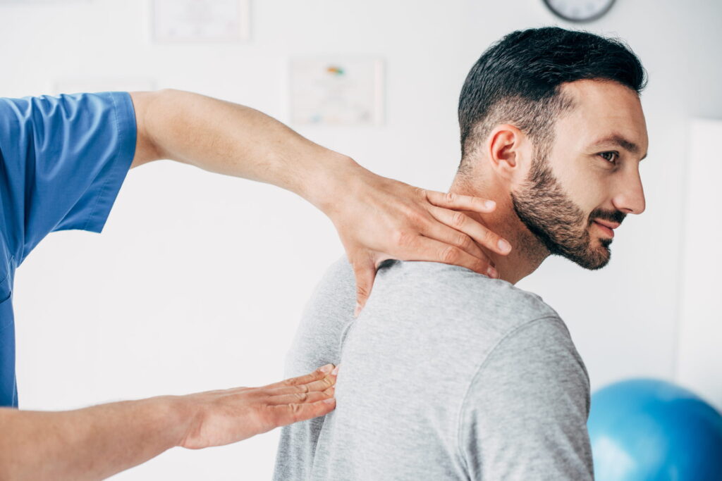 Chiropractor with a patient