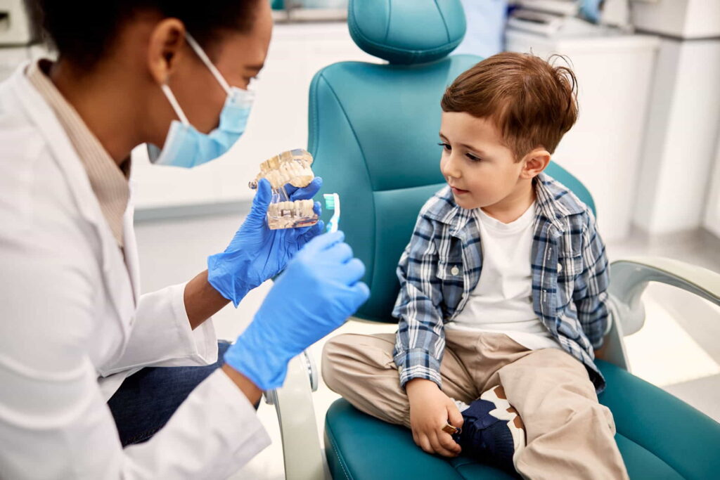 Pediatric dentist with a child