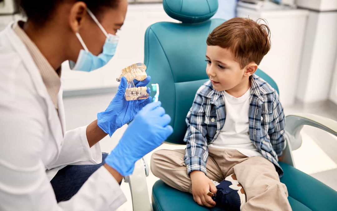 Pediatric dentist with a child