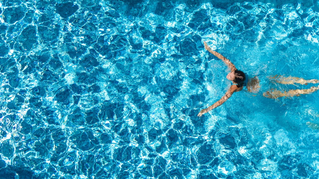 person swimming in a pool